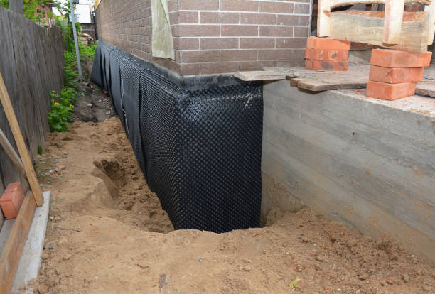 Happy homeowners after waterproofing job in Ducktown